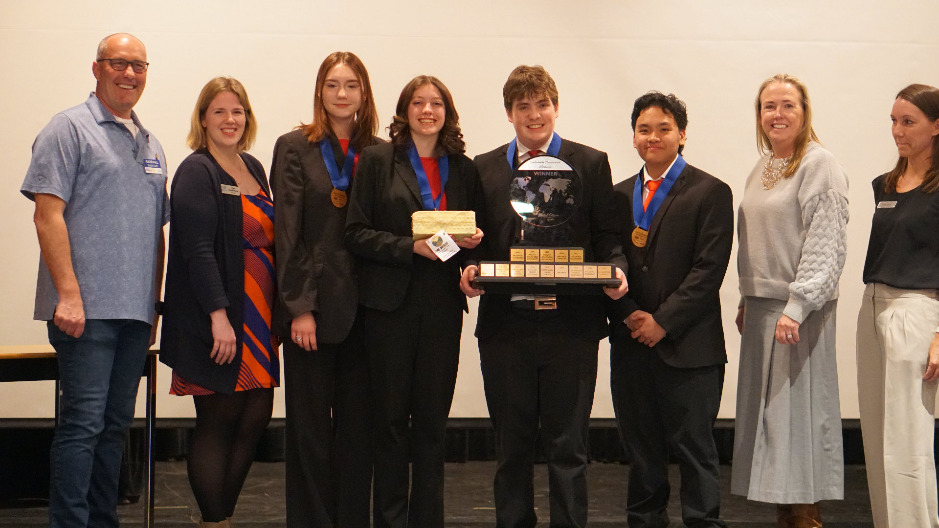 Paper Trail team with their products and trophy