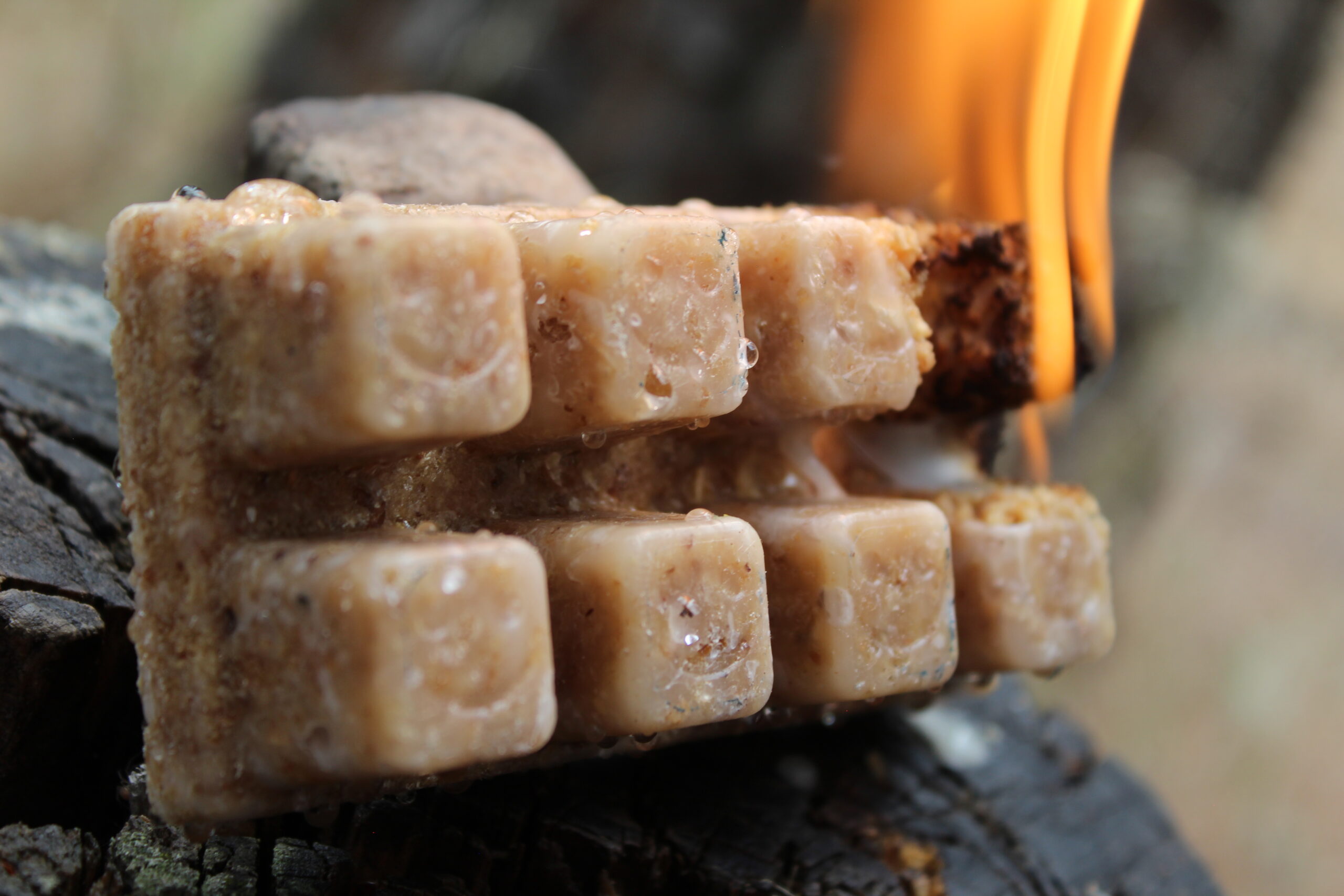 Close-up of Smile Starters with smiling faces and a flame at one end
